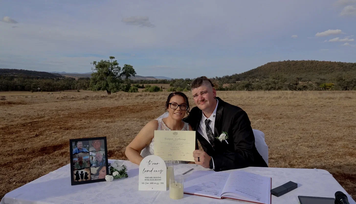 Couple portrait in a timber hexagon frame at dusk