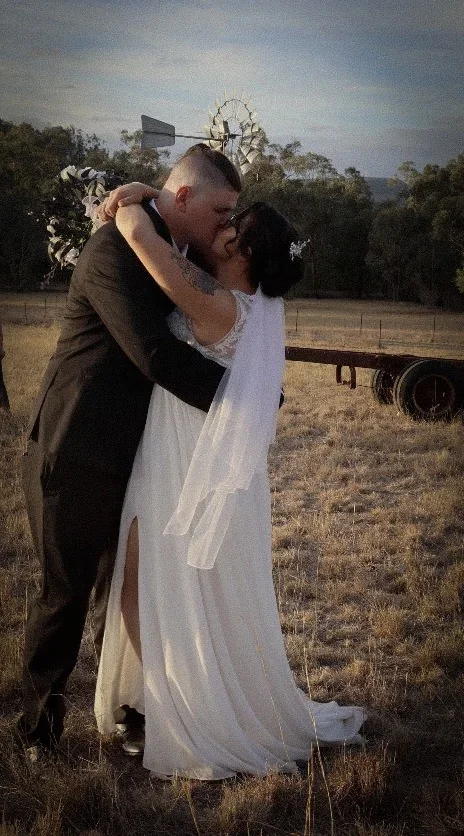 Couple sharing their first kiss at golden hour